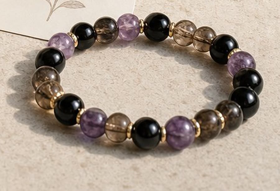 Rest and Restore bracelet of amethyst, smoky quartz and black onyx beads