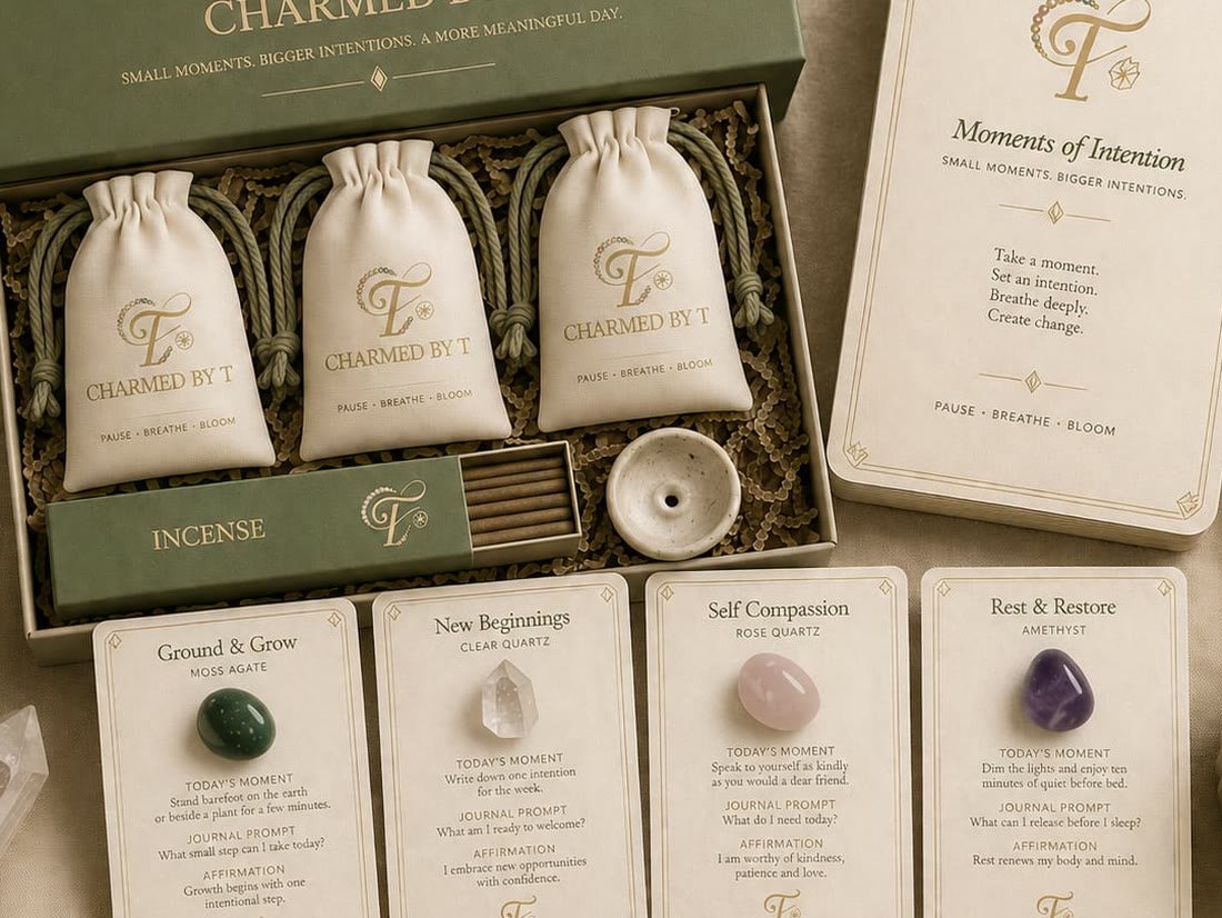 The open sage green box with three crystal pouches, incense and four intention cards laid out below